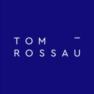 TOM ROSSAU logo