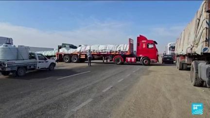 Aid trucks in Egypt wait to cross into Gaza after ceasefire announcement