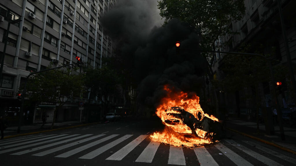 Argentine football fans clash with police at anti-austerity pensions march