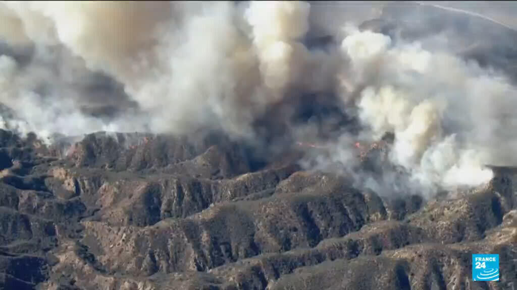 Firefighters battle to maintain the upper hand on a huge fire north of LA