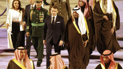 France's Macron arrives in Saudi Arabia as French political crisis looms