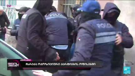 Georgia police raid opposition offices as PM vows to curb protests