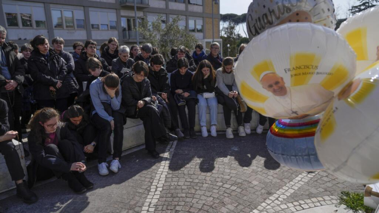 In pictures: Catholics pray for Pope Francis as he remains in critical condition