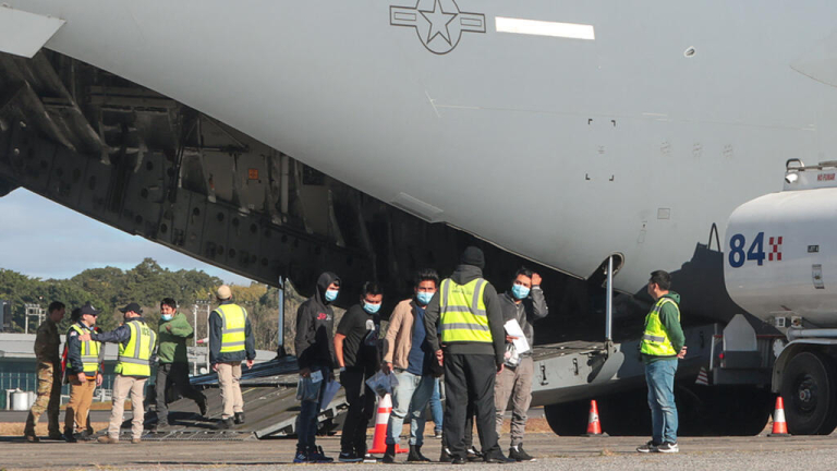 In pictures: First deportation flights of Trump's presidency arrive in Latin America