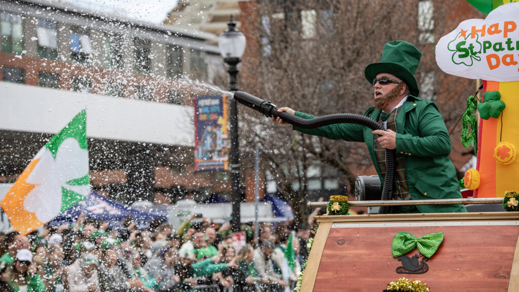 Painting the town green: Crowds fill Boston streets for St Patrick's Day parade