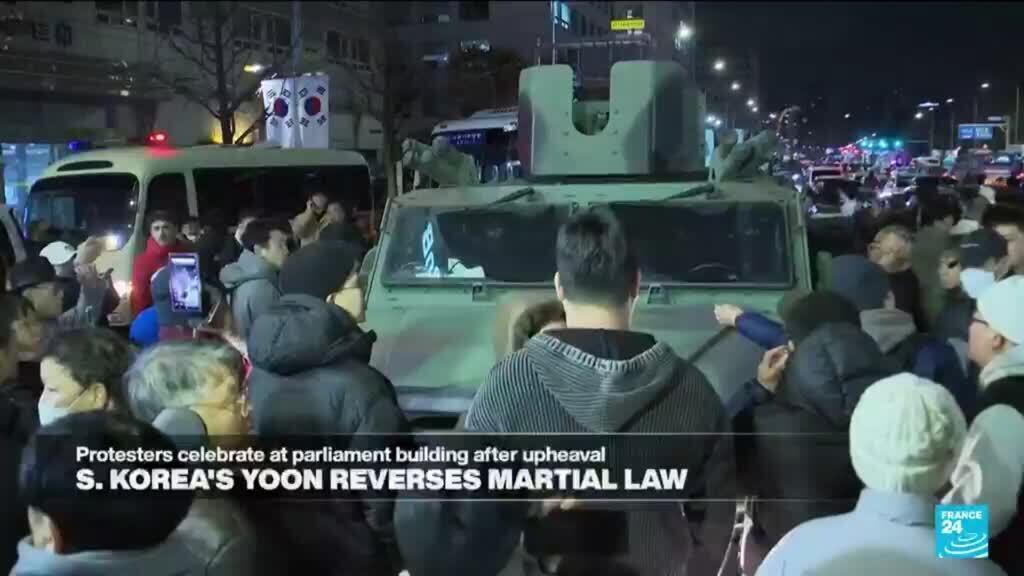 Protesters in Seoul celebrate President Yoon's reversal of martial law attempt